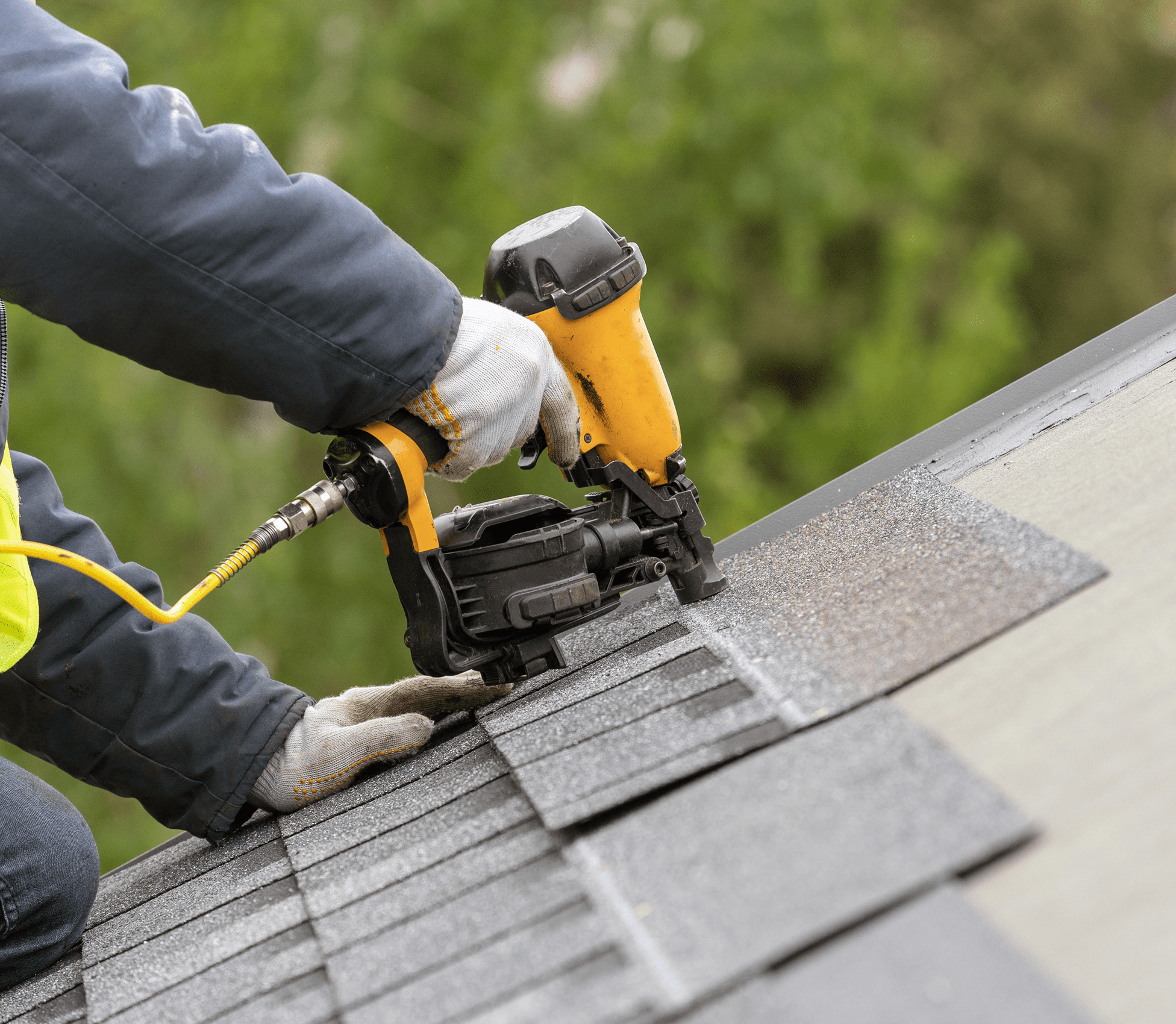 Roofing with nail gun and shingles